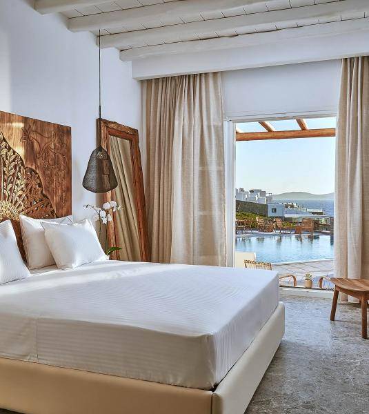 The pool view from the UBUD Mykonos superior room with sea view